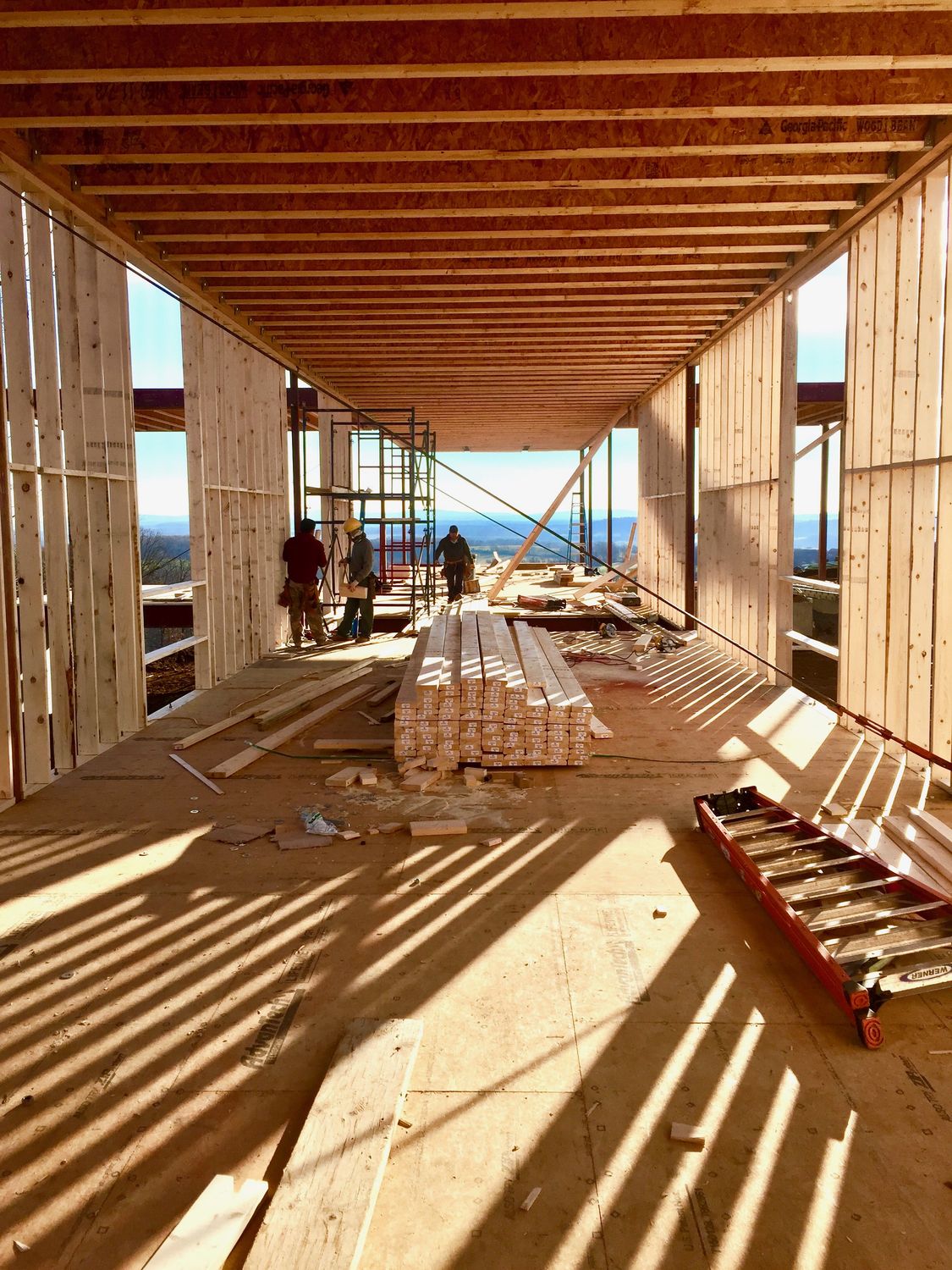 Interior framing of Blue Ridge House with the build crew on site