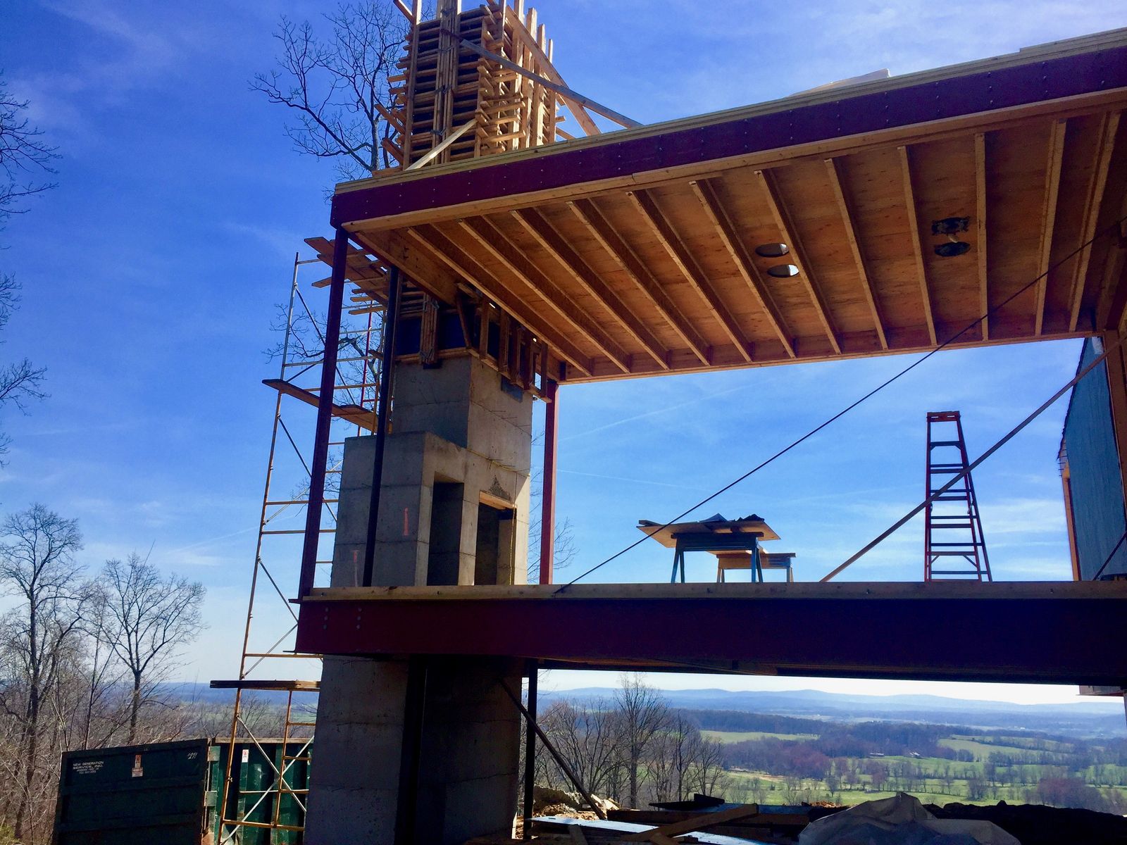 Cantilevered steel structure and board-formed concrete core of Blue Ridge House under construction